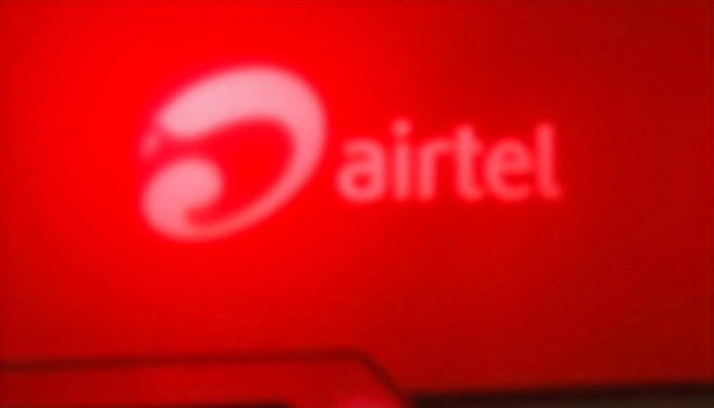 Airtel faded logo in a red background